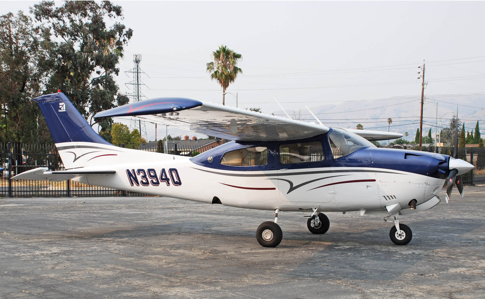 The club’s blue and white Cessna Turbo 210N, N394Q